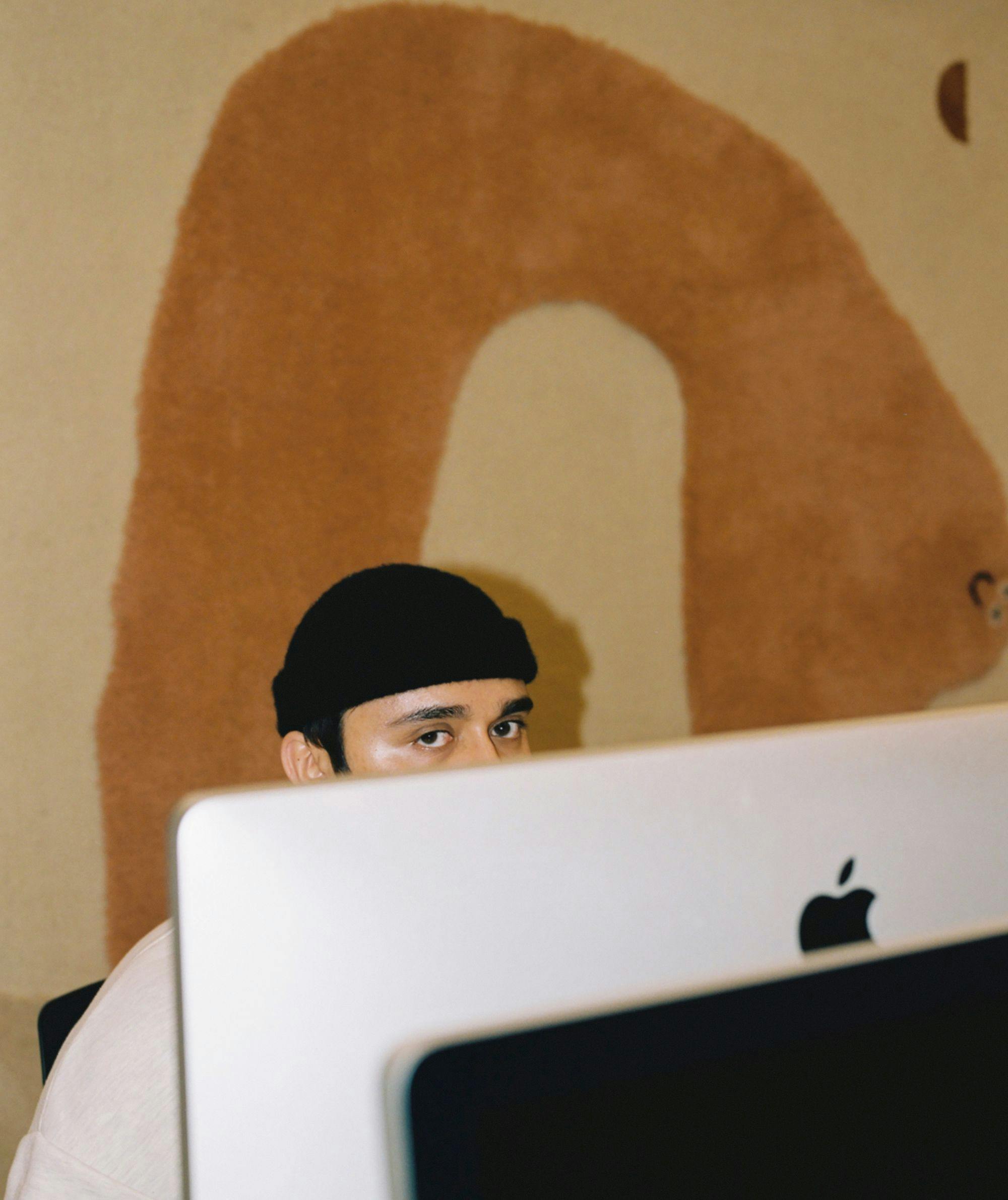 Man behind a computer screen