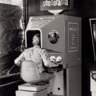 A person using a Sensorama machine, introduced by Morton Heilig in 1962