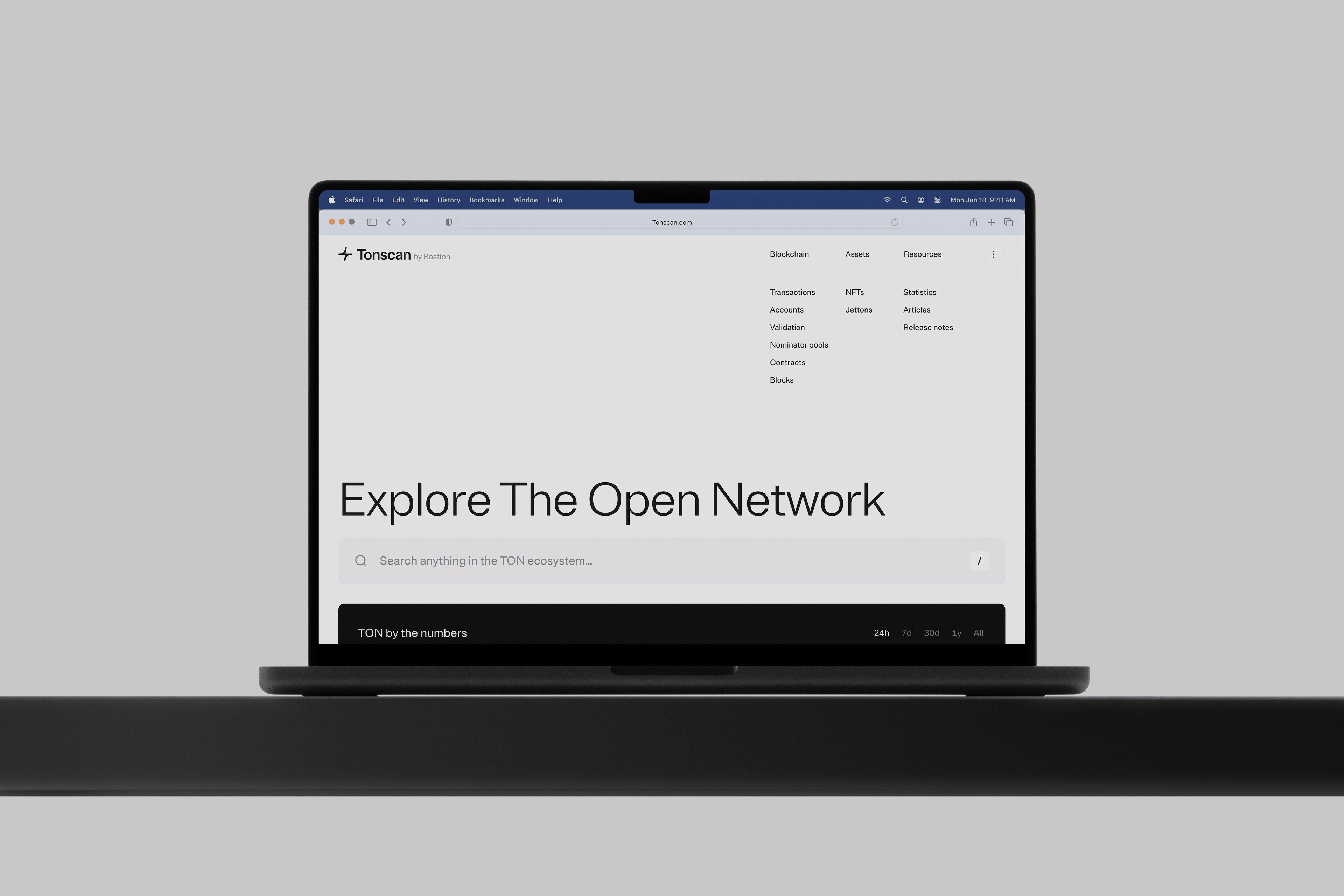 Photo of an open laptop, with the Tonscan homepage open, saying "Explore the Open Network"