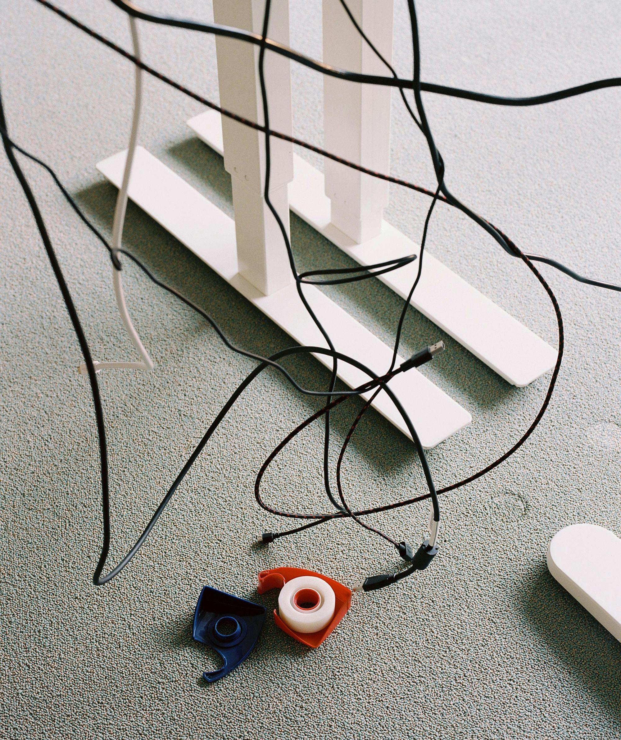 Computer cables and tape dispenser