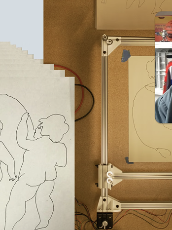 A cropped image of a working space, showing some drawings and an automated drawing machine.